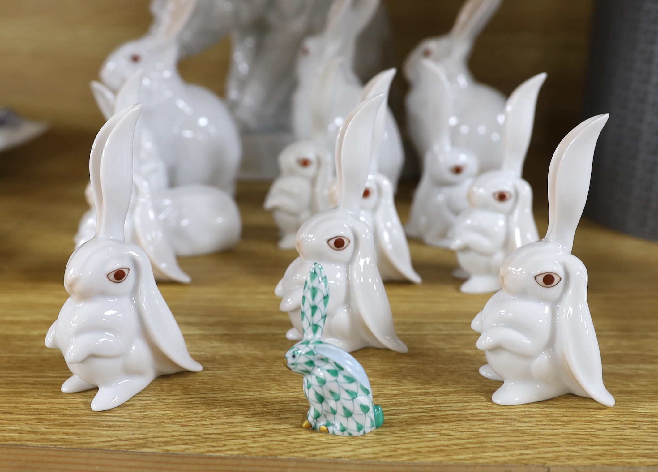 An Herend Polar bear and three sets of four graduated white glazed rabbits and a single green glazed rabbit, all by Herend Polar bear, 20cm high (14)